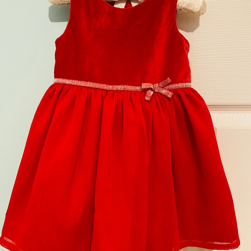 Red dress with sequin bow belt detail.
